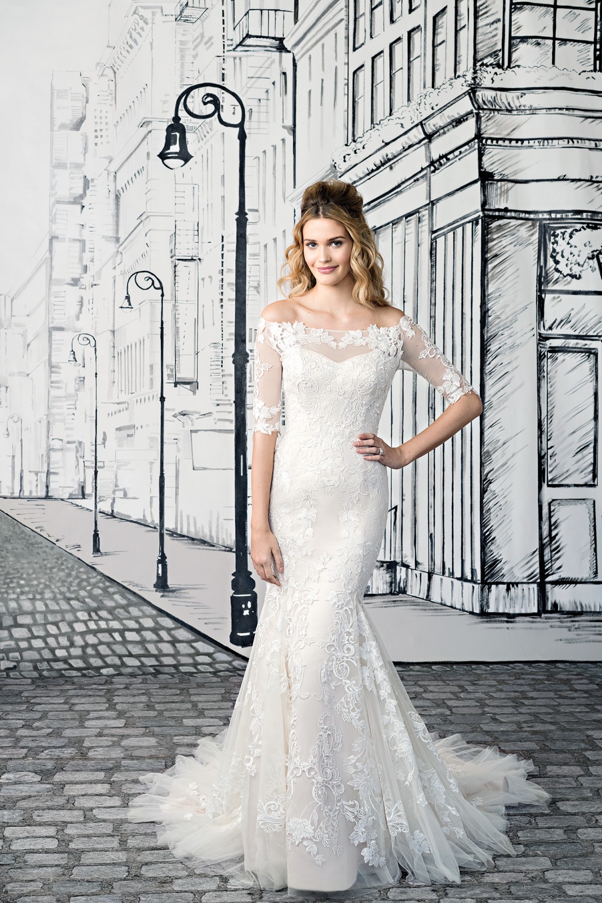 Ivy - Size 12 - Justin Alexander 8903, Off the shoulder lace Mermaid wedding dress with elbow length lace sleeves available at Blessings Bridal Boutique, Brighton, East Sussex, BN1 5GG. Telephone: 01273 505766