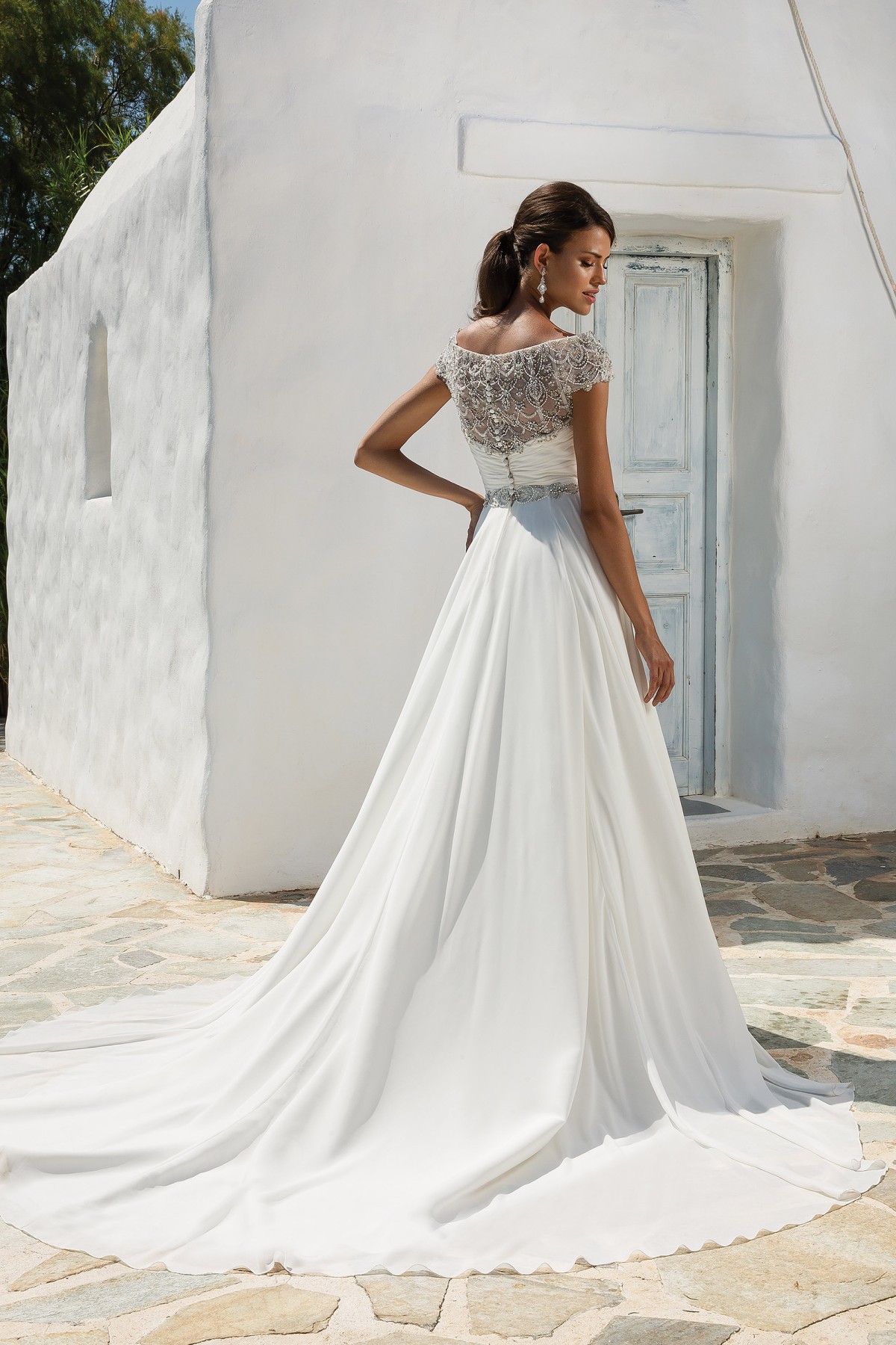 8799 - Aphrodite - Justin Alexander 8799, Chiffon Grecian Style A-line Wedding Dress with Beaded Off the Shoulder Neckline available at Blessings Bridal Boutique, Brighton, East Sussex, BN1 5GG. Telephone: 01273 505766