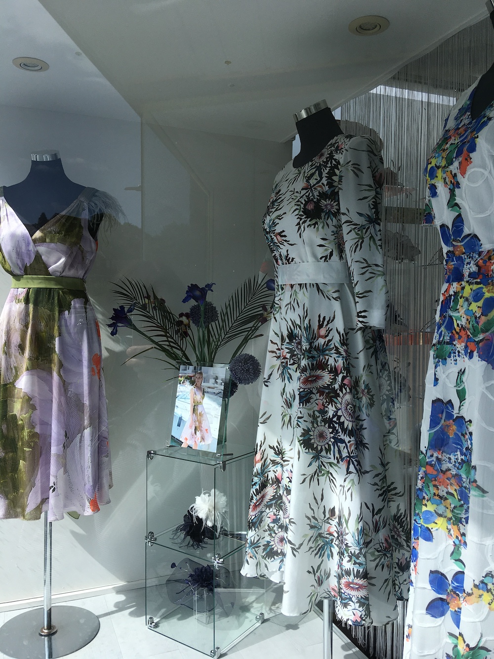 Three Dresses on display in shop