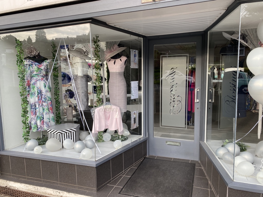 Shop window with formal wear dresses