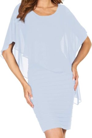 The woman is elegantly dressed in a Frank Lyman 51027, featuring a light blue layered dress with a flowy top.