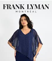 A woman gracefully poses in a blue Frank Lyman - 227008 top, showcasing elegant sheer sleeves against a pristine white backdrop.