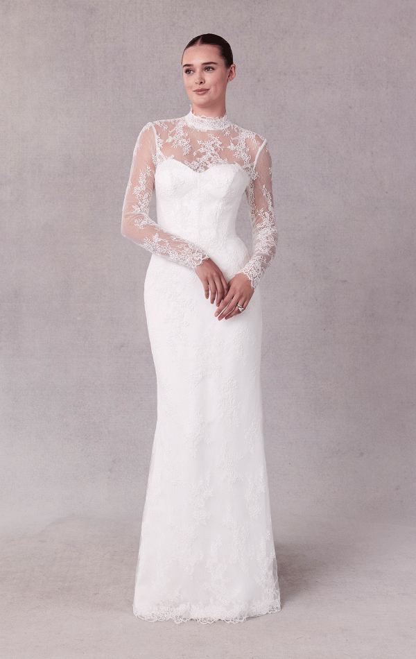 A bride in a Mori Lee 15102 - Sibhon lace wedding dress with sheer long sleeves stands gracefully against a neutral background.