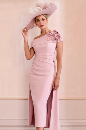 A woman in the elegant John Charles - 29239, a pink off-the-shoulder dress, complemented by a large matching hat with floral detail.