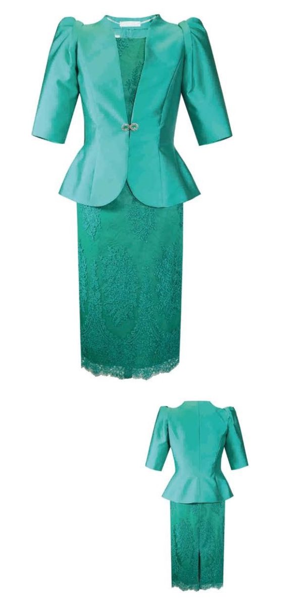 The Carla Ruiz - 99666 suit, exclusively available online, is a stunning emerald green peplum design with short sleeves, a decorative clasp, and a lace skirt.