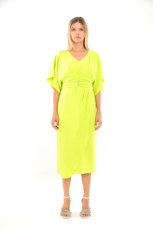 Woman wearing the Lizabella - 2044 midi dress in bright yellow-green with loose sleeves, standing against a white background.